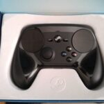 Steam Controller in action, showcasing its ergonomic design and button layout