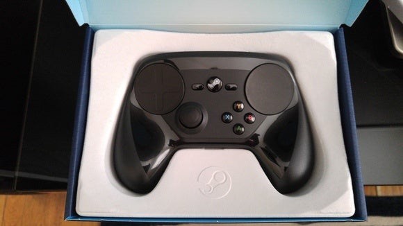 Steam Controller in action, showcasing its ergonomic design and button layout