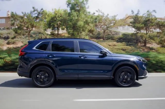 Front view of the 2025 Honda CR-V, showcasing its design in a comparison against the Toyota RAV4