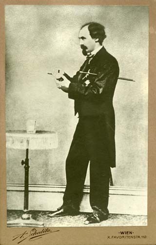 Vintage cabinet card portrait of Herrmann Compars, a 19th-century magician, taken in Vienna by A. Schalita studio.