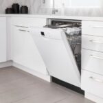 The Bosch SHEM3AY52N 100 Series dishwasher installed in a modern kitchen, showcasing its sleek integration and design.