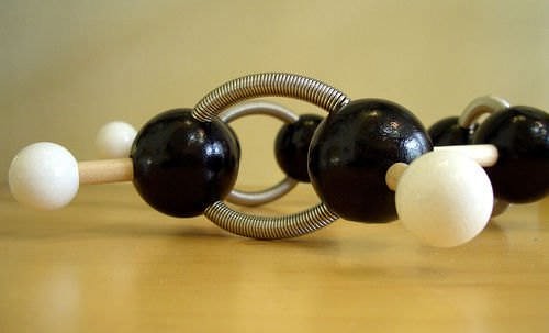 A model of the double and single covalent bonds of carbon within a benzene ring.