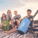 Group of friends enjoying the beach with an ICEMULE Pro Large cooler