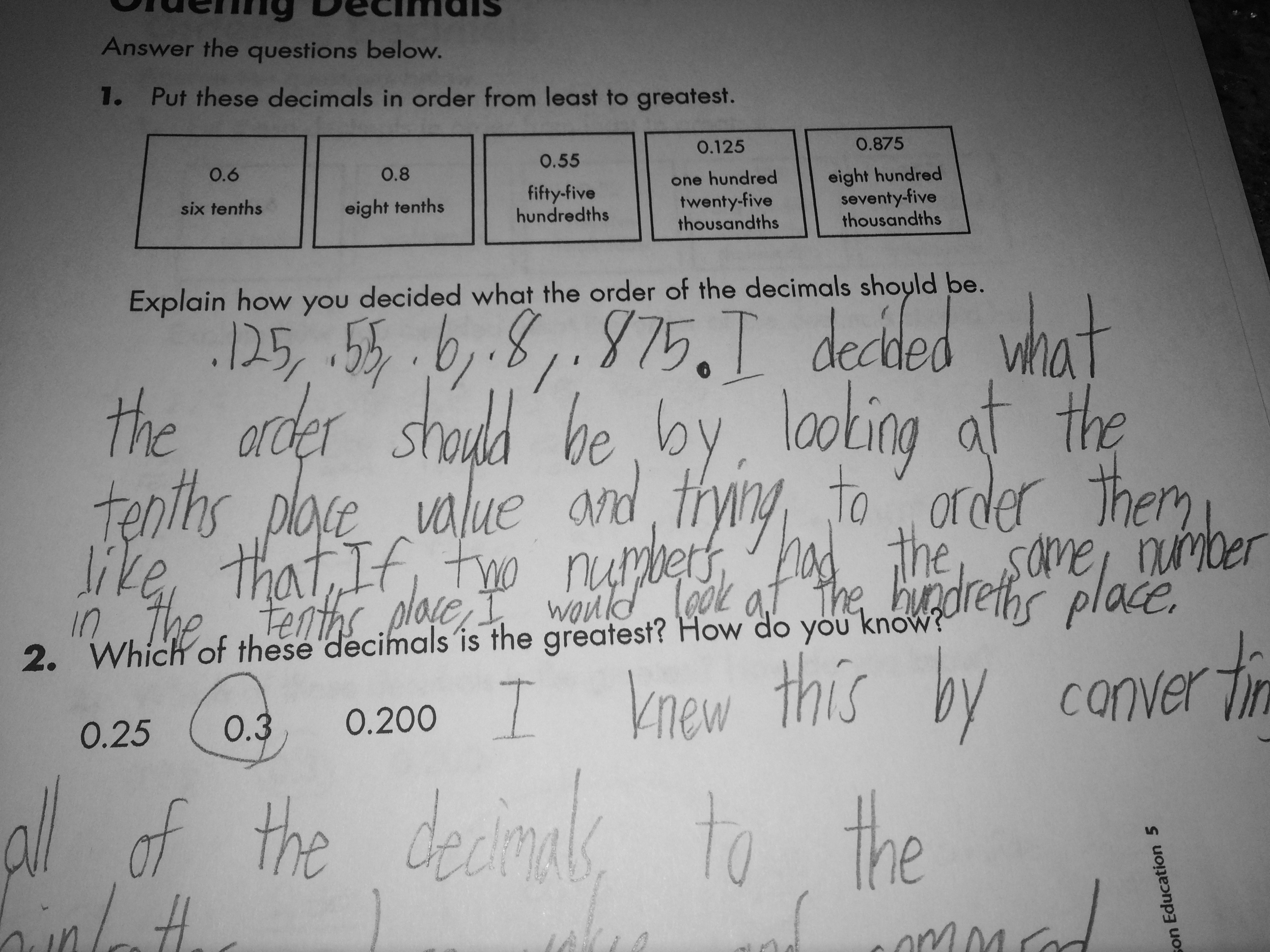 Student work sample showing comparison based on tenths place value