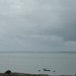 Ships sailing in calm waters, illustrating the historical context of the Horse Latitudes