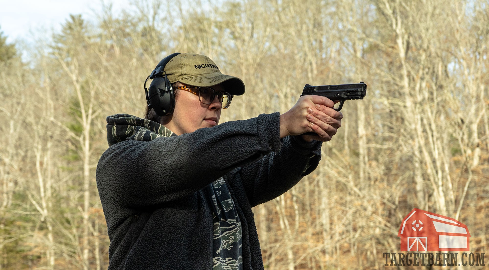 Shooter experiencing recoil from a .380 ACP handgun