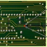 PCB Current Leakage Path: Illustrating conductive paths formed on a printed circuit board due to tracking, impacting insulation resistance.