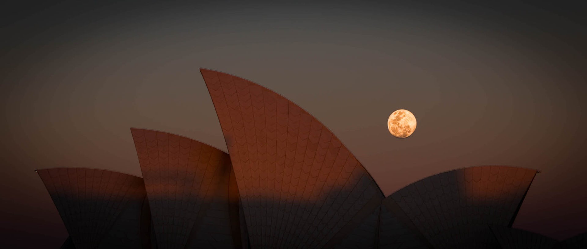The Moon over the Sydney Opera House, symbolizing humanity's relationship with the Moon.