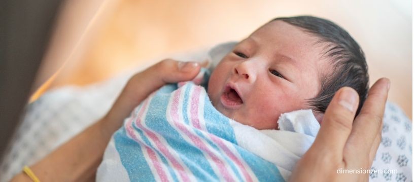 Newborn Baby representing accurate size comparisons for 15 inches