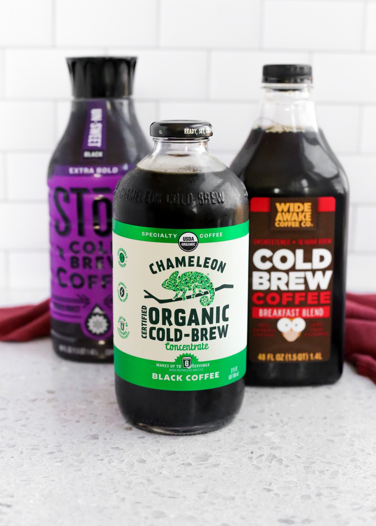Bottles of various cold brew coffee brands on a store shelf