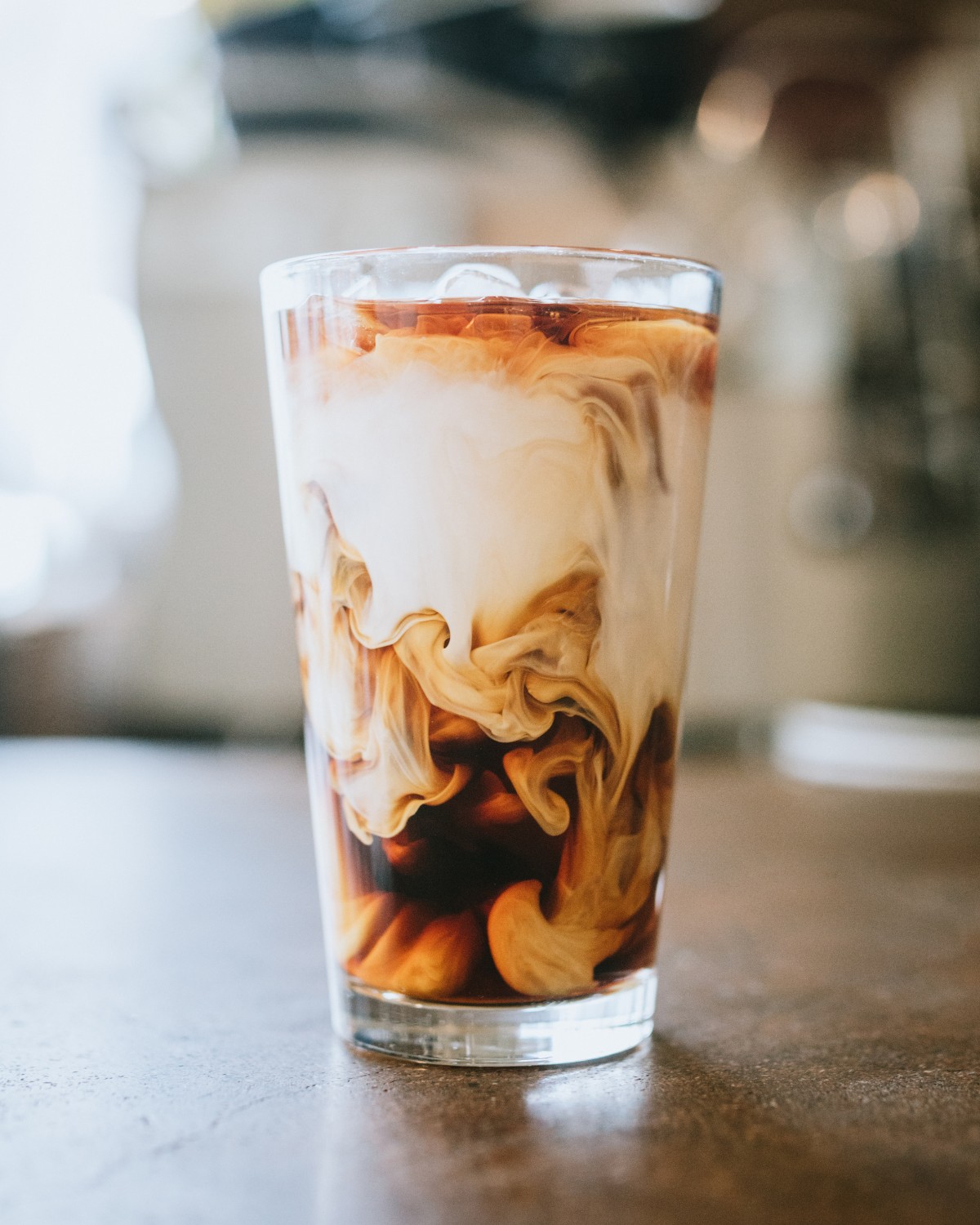 Iced coffee drink with swirling creamer