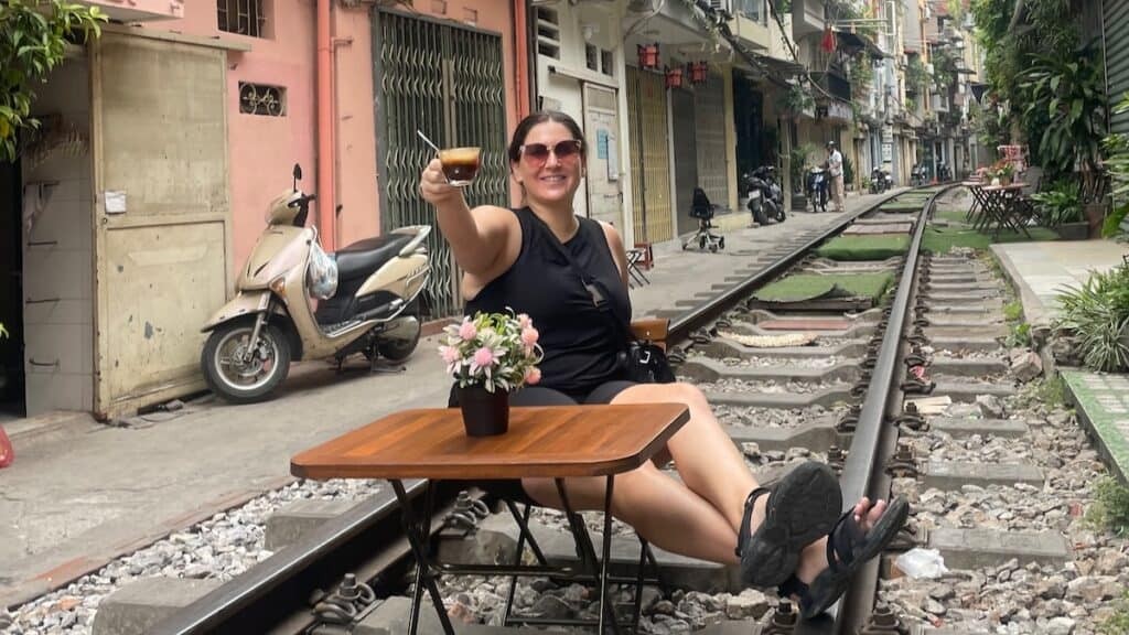 Cheers from Train Street in Hanoi, Vietnam, showcasing the city's vibrant atmosphere and cultural appeal.