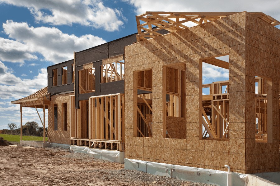 New construction home built on a large lot, showcasing the potential of acreage for spacious living. alt=A modern home is situated on a vast plot of land, highlighting the potential for spacious outdoor areas and future expansion. Keywords: acreage, new construction, spacious living, large lot, modern home