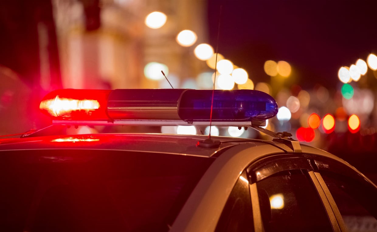 Police officer in uniform standing on the street