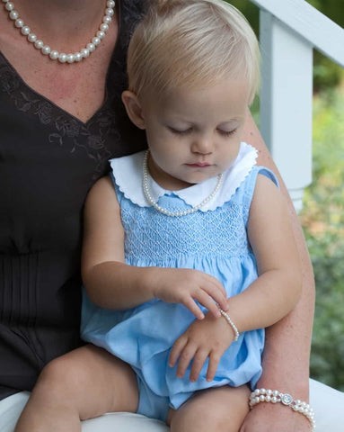 Baby with pearls