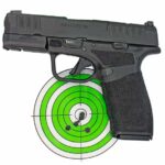 Springfield Hellcat Pro 9mm semi auto handgun on a green and white bullseye target
