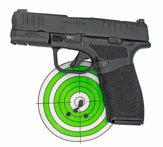 Springfield Hellcat Pro 9mm semi auto handgun on a green and white bullseye target