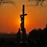 A crucifix, a symbol of Christianity, at sunset