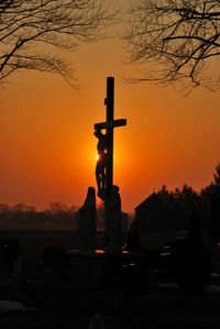 A crucifix, a symbol of Christianity, at sunset