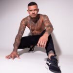 Tattoo artist at work, highlighting the precision and technique involved in tattooing, which can impact pain levels.