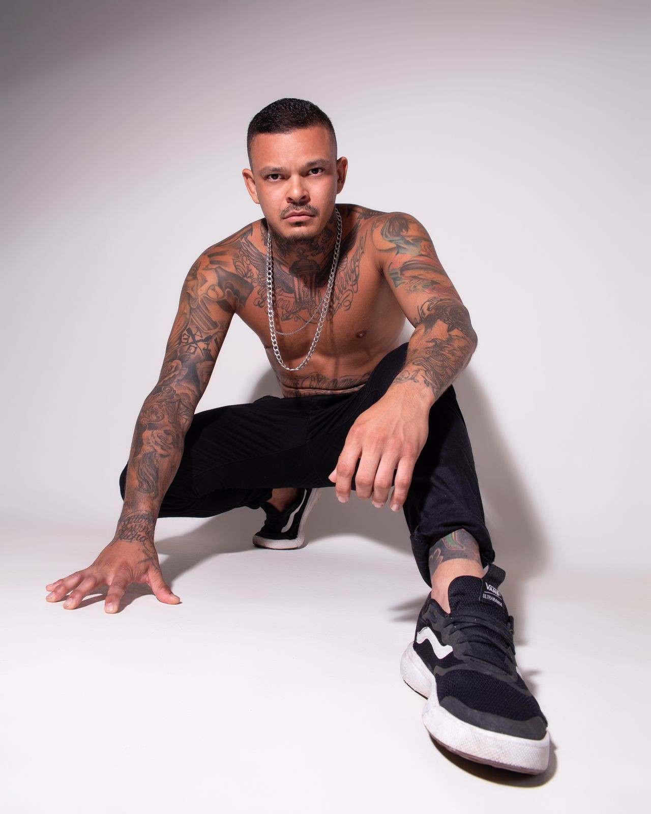 Tattoo artist at work, highlighting the precision and technique involved in tattooing, which can impact pain levels.