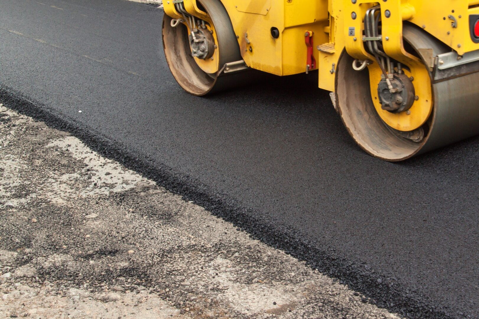 Asphalt driveway being paved