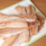 Alaska Pollock fillets on a cutting board