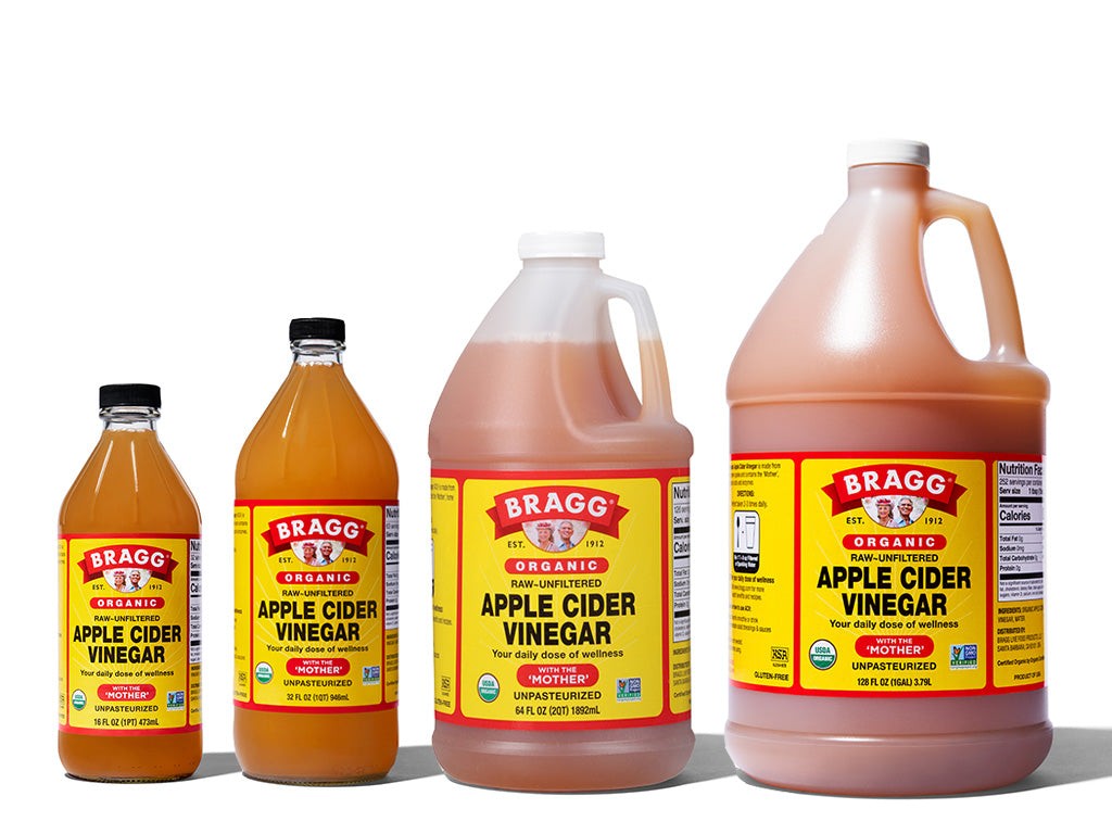 Image of various sizes of Bragg Organic Apple Cider Vinegar bottles, highlighting their amber color and branding