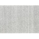 Neutral colored Burrow Cape House Rug featuring a subtle heathered chevron pattern, ideal for adding a cozy touch to a modern living space.