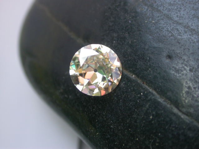 A custom cut moissanite with noticeable color