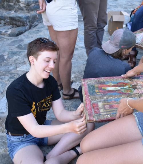 Students using tree-ring dating, showing them extracting core samples from trees and analyzing the tree rings, illustrating the hands-on approach in dendrochronological research