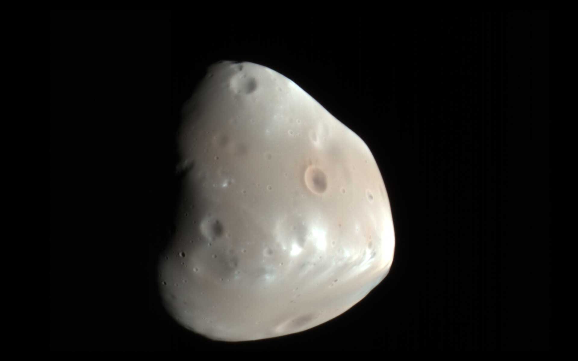 This enhanced-color image of Deimos, the smaller of the two moons of Mars, was taken on Feb. 21, 2009. The image was taken by HiRISE (High Resolution Imaging Science Experiment) on NASA's Mars Reconnaissance Orbiter.