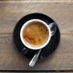 Close-up of an espresso machine dispensing coffee into a cup