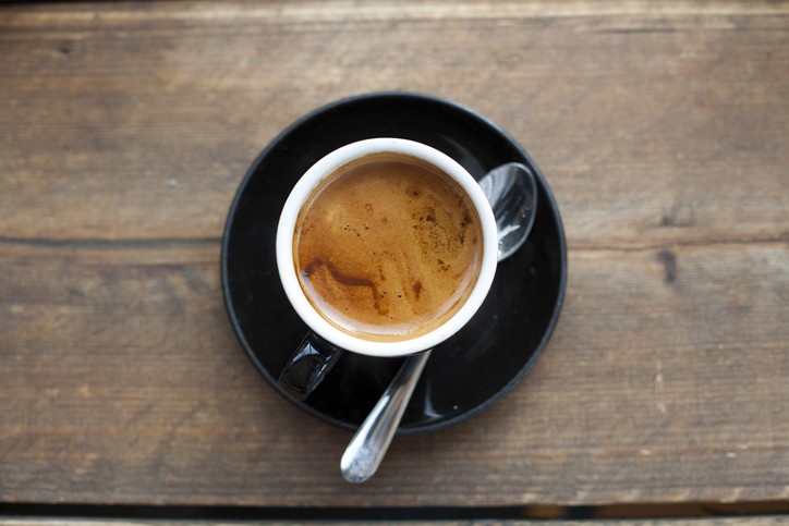 Close-up of an espresso machine dispensing coffee into a cup