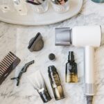 Oribe miniature products on countertop Oribe gold lust oil Oribe Gold Lust conditioner Oribe signature shampoo