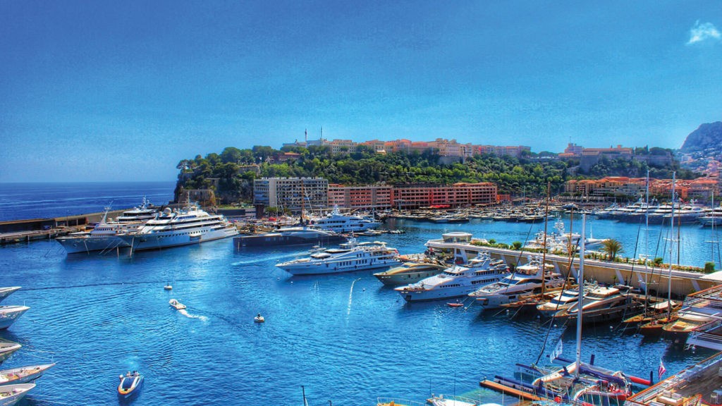 Monaco city with high-rise buildings and Mediterranean Sea