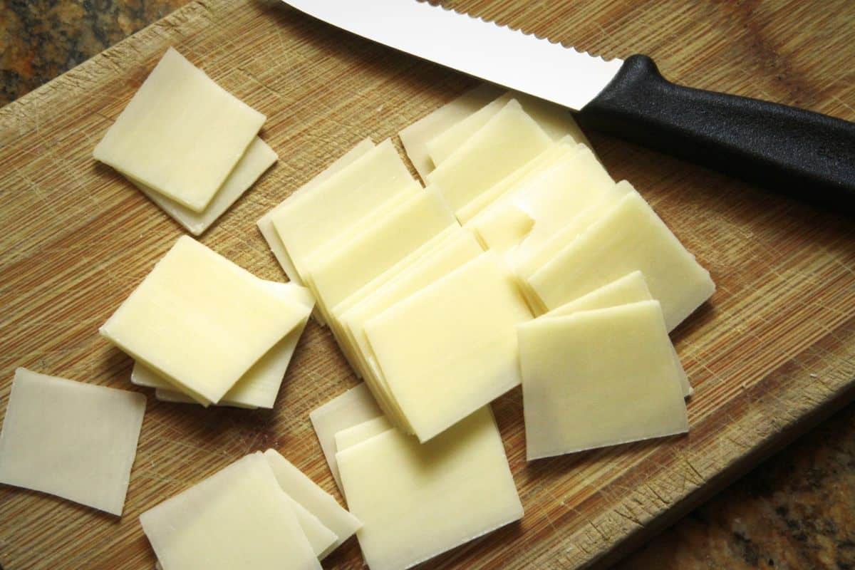 Monterey Jack cheese sliced on a chopping board