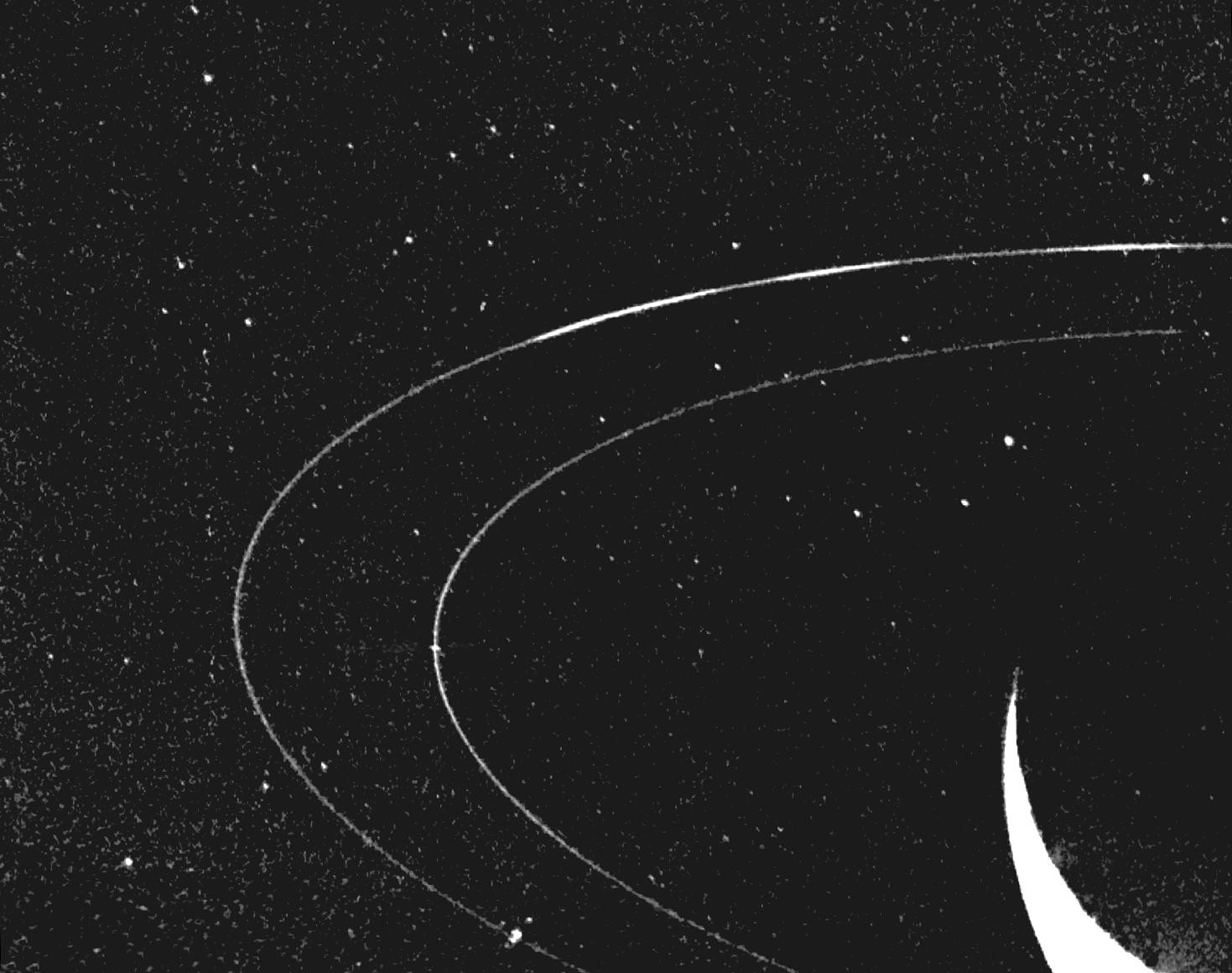 An illustration comparing Neptune's rings and arcs with its moons