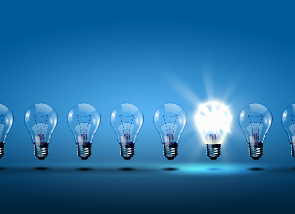 Row of light bulbs with one different