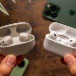 Sony WF-1000XM5 and Apple AirPods Pro 2 cases being held in hands