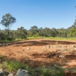 how big is 100 acres in football fields
