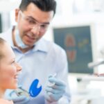 Young female patient being fitted for Invisalign and deciding is invisalign better than braces