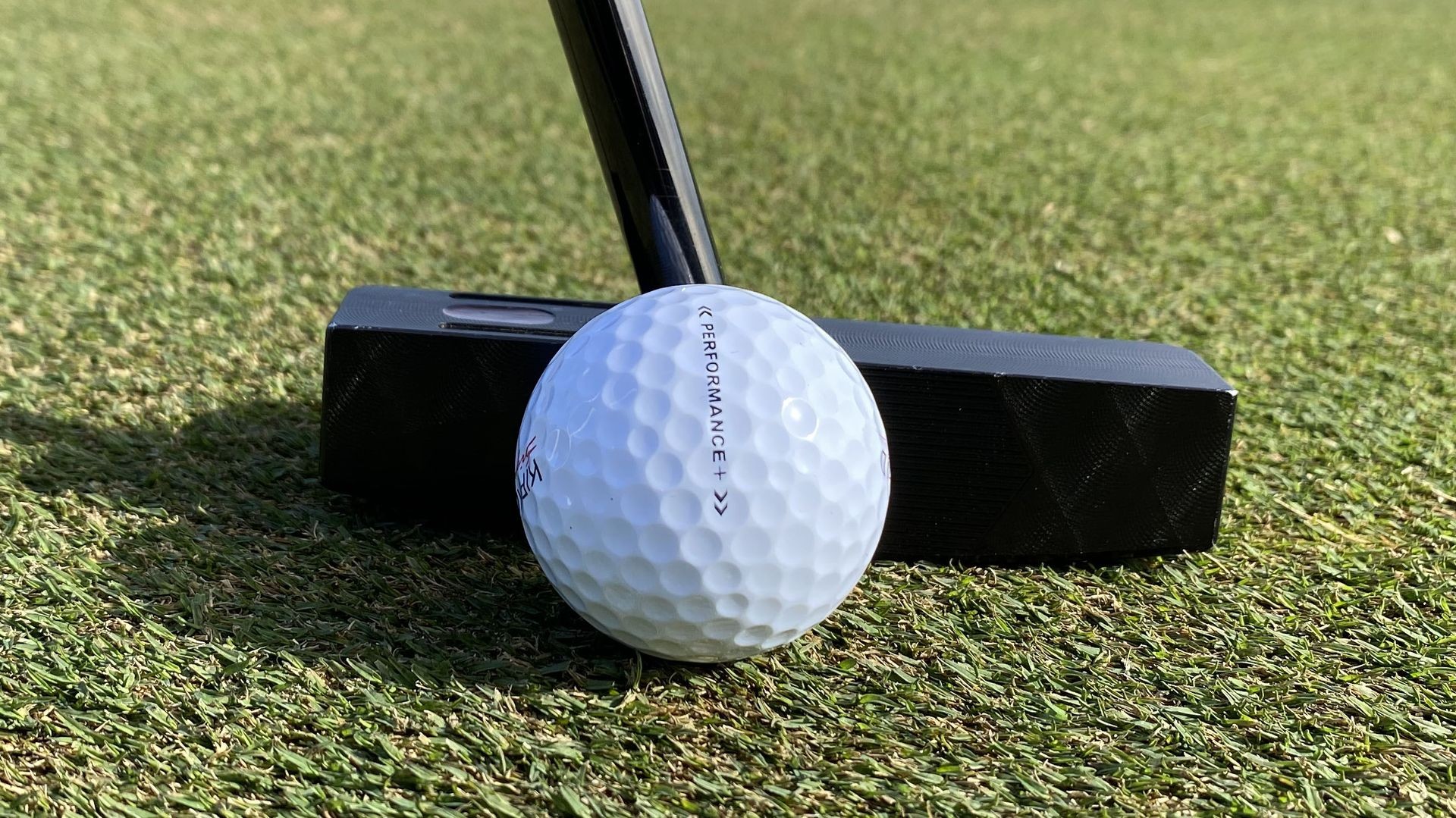 Close-up of golf balls with varying dimple patterns